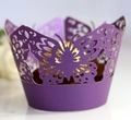 Close-up of laser-cut purple butterfly cupcake wrapper with golden chocolate inside - Dark Purple