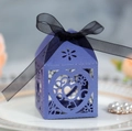 Macro detail of purple laser-cut wedding favor box with heart patterns and black ribbon - Sapphire Blue