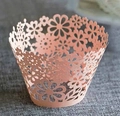 Close-up of laser-cut light pink floral cupcake liners on grey textured fabric background - 5cm / Pink