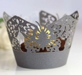 Macro detail of laser-cut butterfly cupcake wrapper in dark grey pearlescent finish - Silver Charcoal