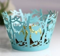 Dettaglio macro di pirottini per cupcake a forma di gufo tagliati al laser in blu - Blu Tiffany