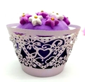 Detail of purple cupcake-shaped bath bomb with laser-cut heart pattern lace wrapper - Light Purple