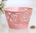 Pink laser-cut paper cupcake wrappers with heart and floral patterns for wedding decor - Pink