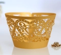 Detailed laser-cut heart and floral pattern on golden pearlescent cupcake wrappers - Gold
