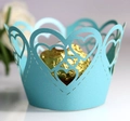 Detail of laser-cut heart pattern on light blue cupcake wrapper with gold chocolate - Tiffany Blue