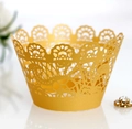 Elegant gold hollow cupcake wrapper with intricate lace floral laser cut design - Gold