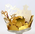 Golden Halloween cupcake wrapper featuring witch and castle silhouette with shiny finish - Reflective Gold