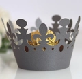 Macro detail of laser-cut grey crown cupcake wrapper with delicate hollowed pattern - Silver Charcoal