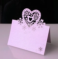 Detail of laser-cut heart-shaped ivory place card with elegant floral hollow design - Light Purple
