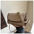 Close-up of beige crossbody bag featuring woven handle and FASHION & BAGS lettering - Khaki With Pendant