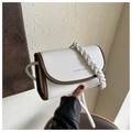 Detail of the litchi pattern faux leather texture and woven shoulder strap on the square bag - White Without Pendant