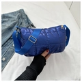 Detail of royal blue quilted crossbody bag with glossy finish and gold metal buckle - Blue