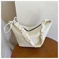 Off-white canvas dumpling bag with cloud-like scrunchie strap and bow detail - White