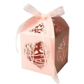 Detail of pink laser-cut candy box featuring hollow heart bird patterns and organza ribbon - Pink
