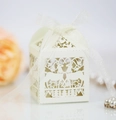 Laser-cut white gift box with reindeer patterns and white ribbon for holiday favors - Ivory