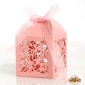 Detail of pink laser-cut gift box with hollow pattern and elegant organza ribbon bow - Pink