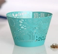 Detailed laser-cut pattern on mint green cupcake wrappers for elegant dessert decor - Tiffany Blue