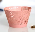 Elegant light pink laser-cut cupcake wrappers with intricate hollow patterns for desserts - Pink