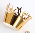 Macro detail of gold butterfly lace cupcake wrappers with intricate hollow-cut texture - Reflective Gold