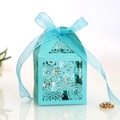 Detail of laser-cut floral pattern and organza ribbon bow on blue wedding gift box - Teal Blue