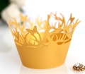 Ginger yellow laser-cut cupcake wrappers with butterfly and antler design on white background - Gold