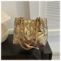 Chic metallic gold quilted tote bag with brown leather straps for modern casual style - Gold