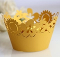 Intricate laser-cut gold pearlescent paper cupcake wrapper with floral sun pattern detail - Gold