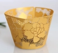 Detail showing the intricate laser-cut floral pattern of the golden cupcake wrapper - 5cm / Gold