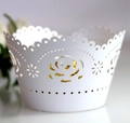 White laser cut cupcake wrappers with hollow rose floral pattern for elegant party decor - White