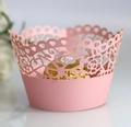 Detail of pink laser-cut cupcake wrapper with intricate floral and heart patterns - 5*5*8CM / Pink