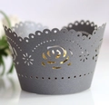 Macro view of grey laser-cut rose cake wrapper with delicate scalloped dot edges - Silver Charcoal