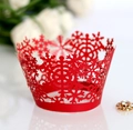 Macro shot of red laser-cut snowflake cupcake wrappers for Christmas dessert table - Pearlescent Red