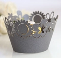 Macro detail of sky blue laser-cut sunflower cupcake wrapper with pearl paper texture - Silver Charcoal