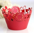 Macro view of detailed sunflower laser cut-out patterns on red cupcake wrappers - Pearlescent Red