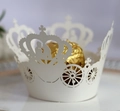 Intricate laser-cut crown and pumpkin carriage white paper cupcake wrappers detail - Ivory