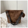 Close-up of brown suede tote bag with a colorful ethnic pattern wide shoulder strap - Brown