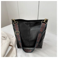 Detail of black large tote bag with colorful ethnic patterned woven shoulder strap - Black