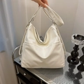 Versatile cream white oversized hobo bag in soft leather with adjustable silver hardware - Off White