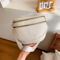 White textured leather waist bag with wide strap and gold dual zippers in daily use - Off White