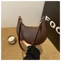 Brown faux leather hobo bag with gold hardware and a vibrant red lining for women - Coffee