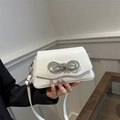 White minimalist PU leather crossbody bag with a sparkling rhinestone bow decoration - White