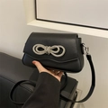 Classic black leather crossbody bag with sparkling silver rhinestone bow decoration - Black