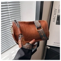 Detailed view of brown retro Boston bag with a wide colorful geometric ethnic strap - Tan