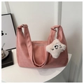 Detail of dusty pink PU leather tote bag with star plush charm and zipper closure - Pink With Pendant