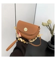 Elegant tan saddle bag with gold clasp and floral scarf wrapped chain strap - Brown