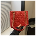 Vibrant red crossbody bag with leaf-like diamond quilted texture and gold chain strap - Red
