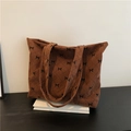 Bolso tote marrón de pana con acolchado de rombos y lazos pequeños negros - café