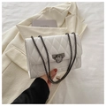 White quilted diamond stitch shoulder bag with black metal chain strap and lock closure - White