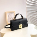 Minimalist black leather handbag with a gold lock and adjustable crossbody strap - Black