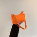 Bright orange faux crocodile shoulder bag with stylish acrylic chain and wide fabric strap - Orange